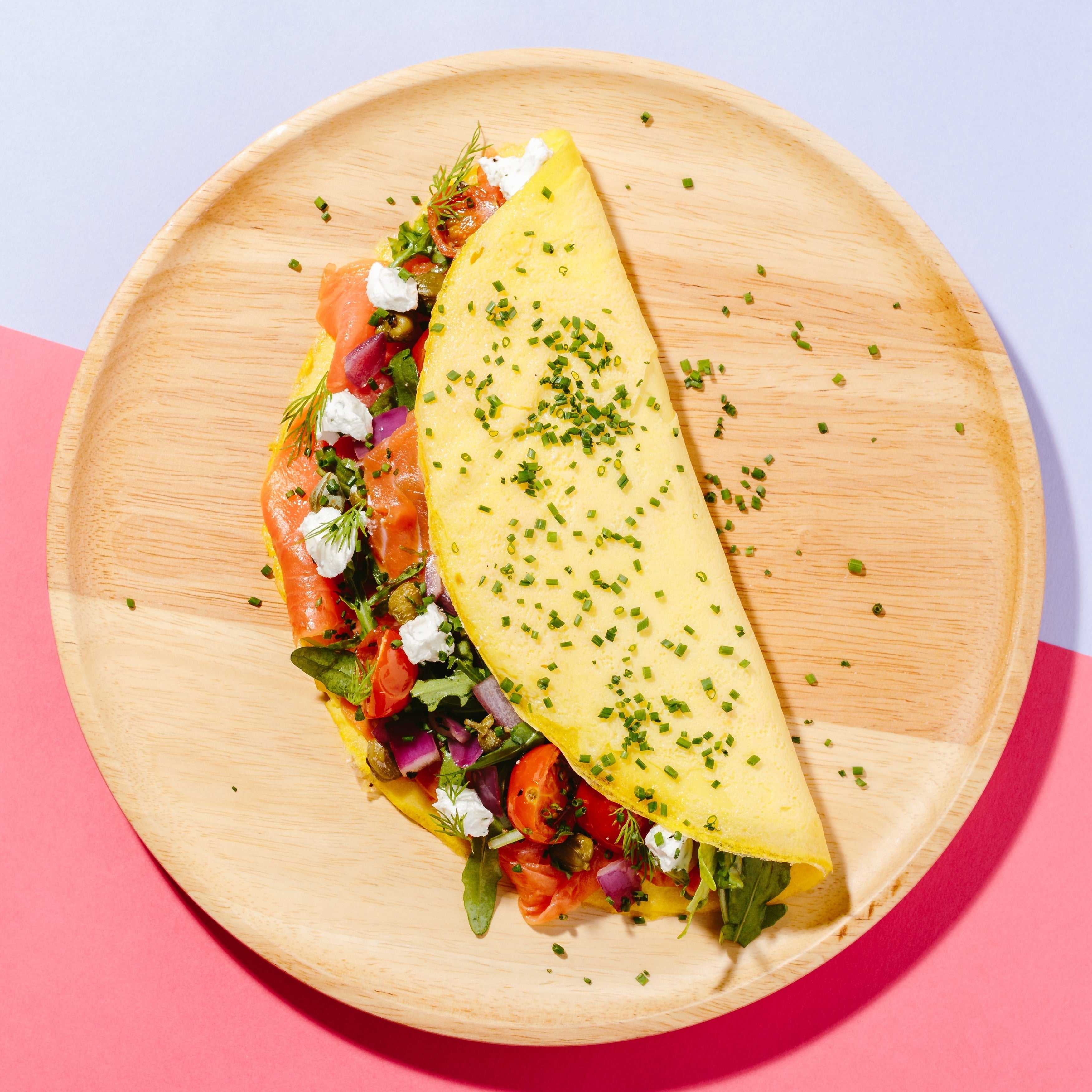 Smoked Salmon Omelette with Rocket, Red Onions, Capers, Dill, Cherry T