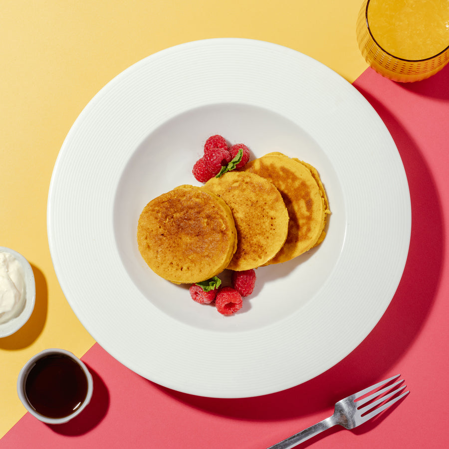 Lemon & Sunflower Seed Pancakes with Raspberries, Vanilla Yogurt Sauce & Maple Syrup