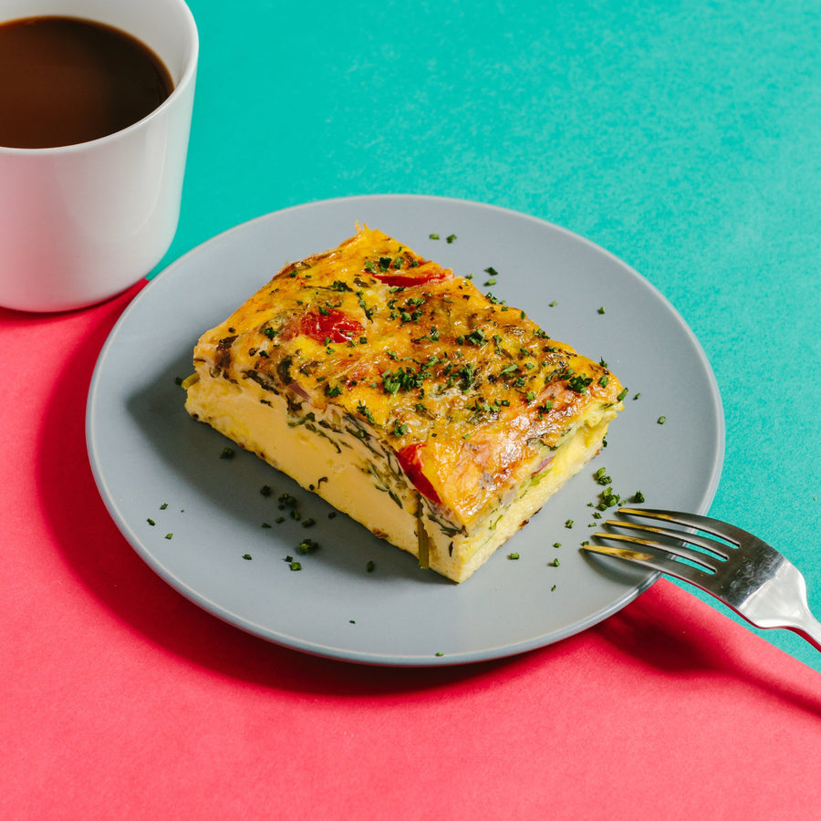 Baked Pecorino Frittata with Rocket Lettuce, Oven Roasted Cherry Tomato, Confit Garlic & Rosemary