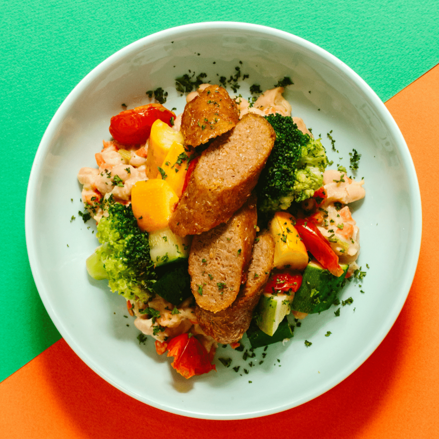 White Bean Cassoulet with Beyond Sausage, Kale, Zucchini and Oven Dried Cherry Tomatoes